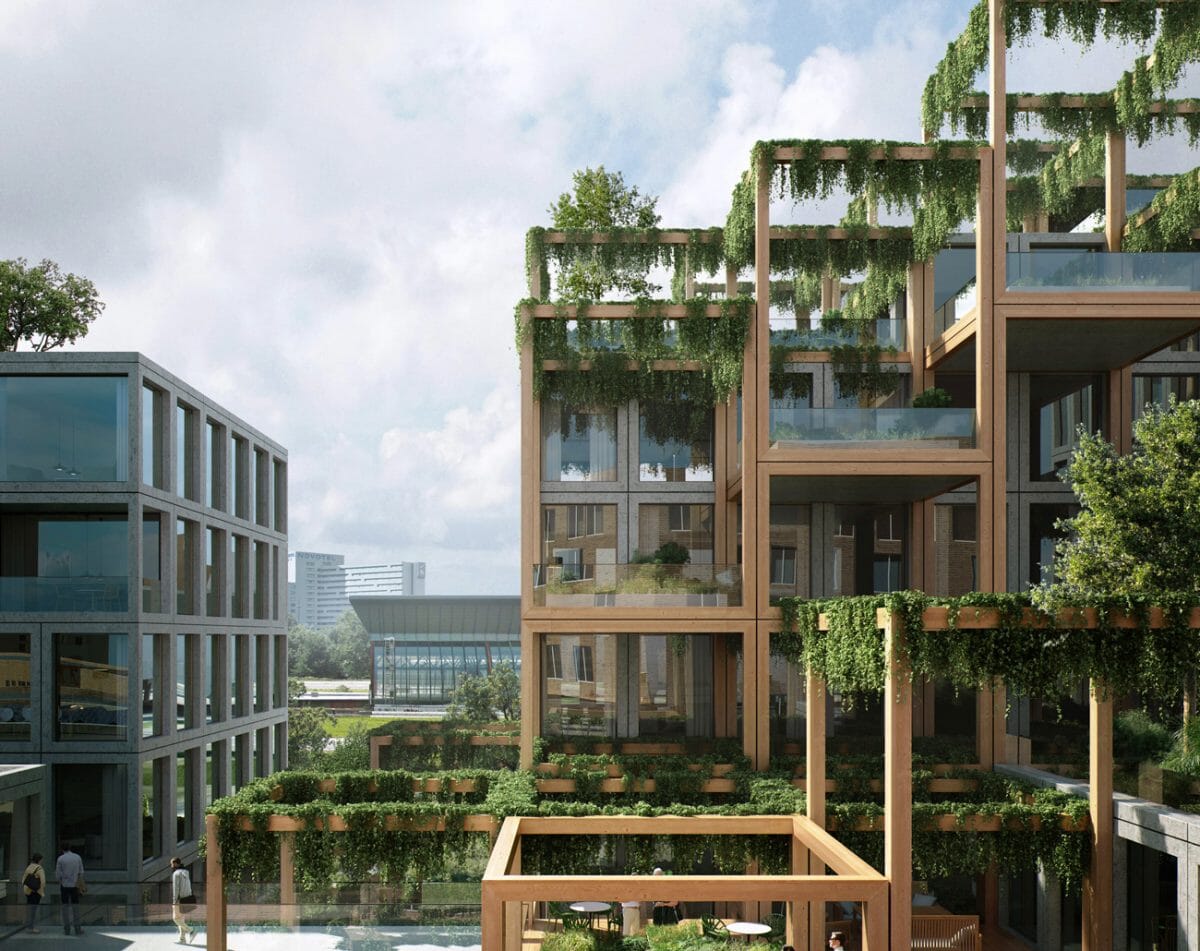  Modern tiered building with extensive green foliage hanging from wooden pergolas and balconies, next to a more conventional glass building.