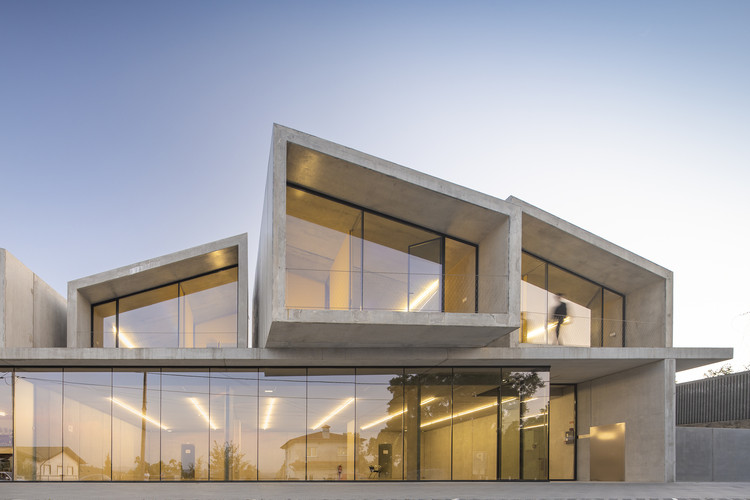 Contemporary architecture featuring sharp angles and cantilevered sections, creating prominent window frames.
