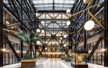 Contemporary building interior featuring exposed structural elements and natural light.