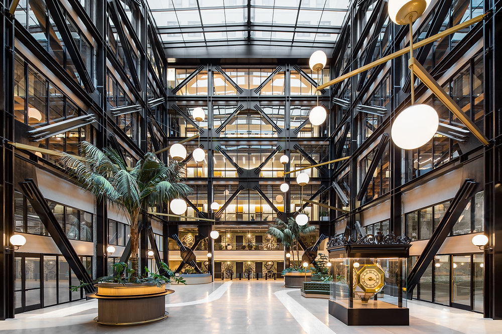 Contemporary building interior featuring exposed structural elements and natural light.