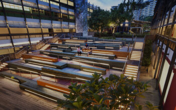Modern tiered outdoor seating area with integrated lighting and accessible ramps.