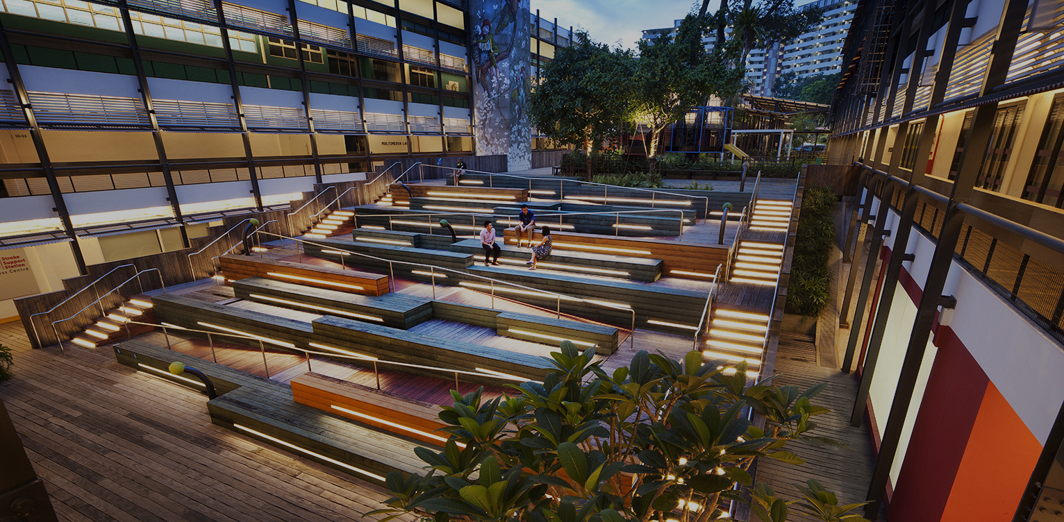 Modern tiered outdoor seating area with integrated lighting and accessible ramps.