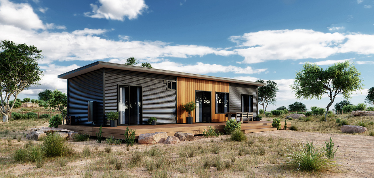 Contemporary modular home with a dark facade and wooden entrance in a rural setting.