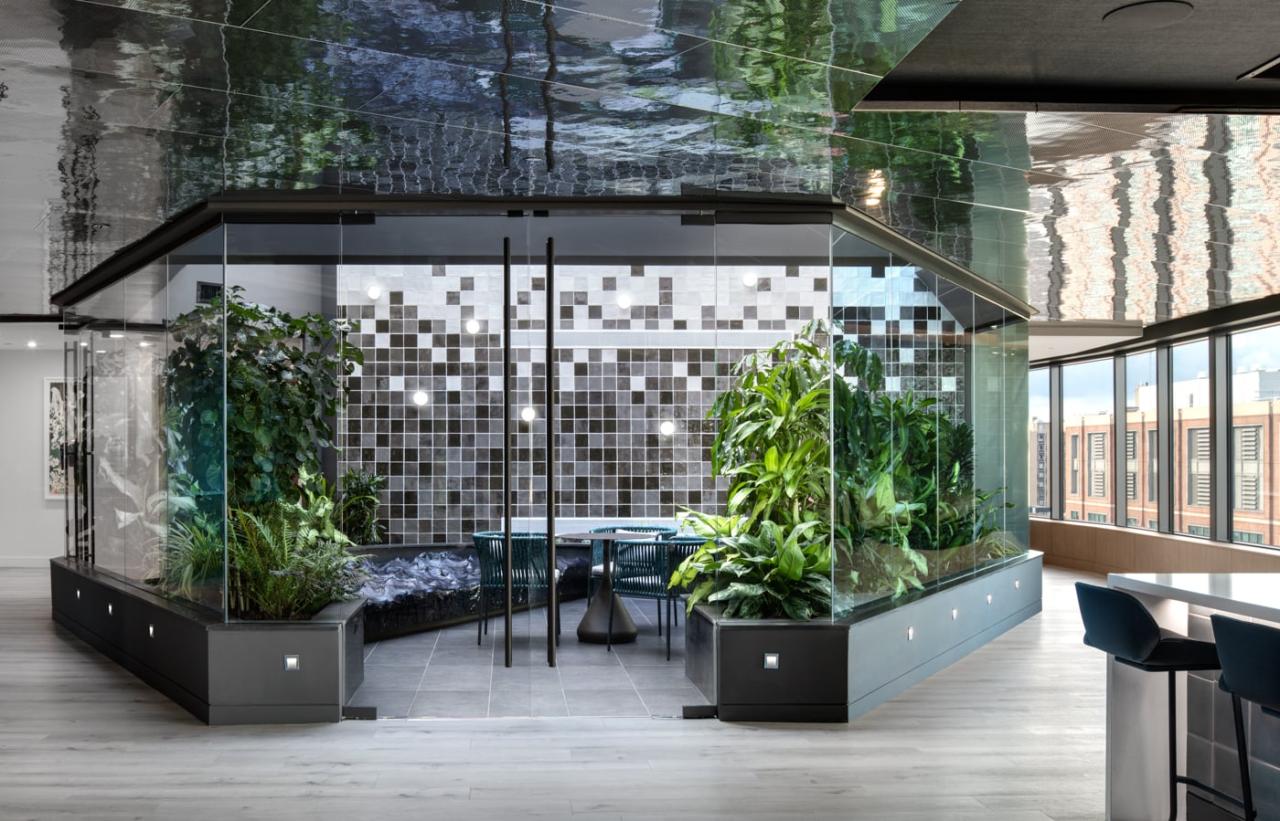 Urban building with integrated greenery and outdoor terraces, promoting green living.